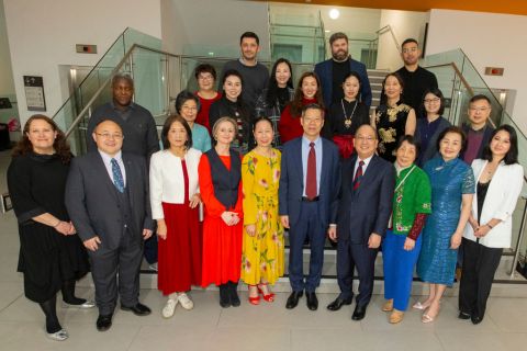 Group of people standing on the steps of the atrium in the Ulster Museum