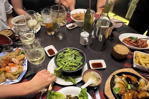 Plates of Chinese dishes on top of table in Zen restaurant Belfast