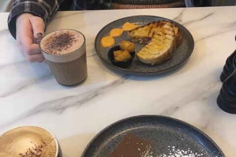 Plates of food and drinks on table