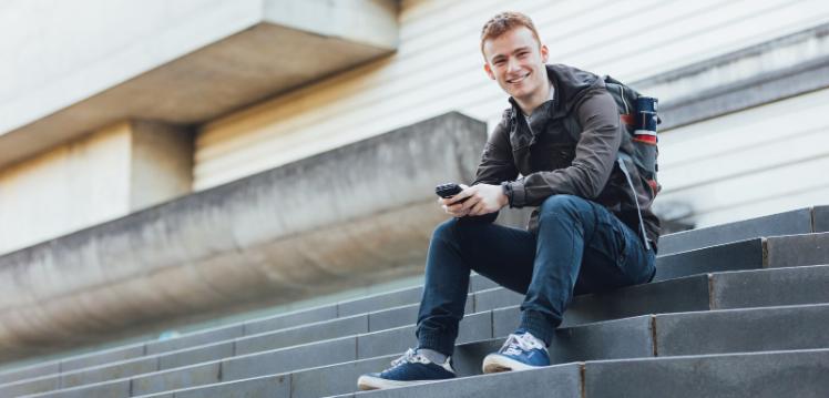 Student Conor sits on Ulster Museum steps