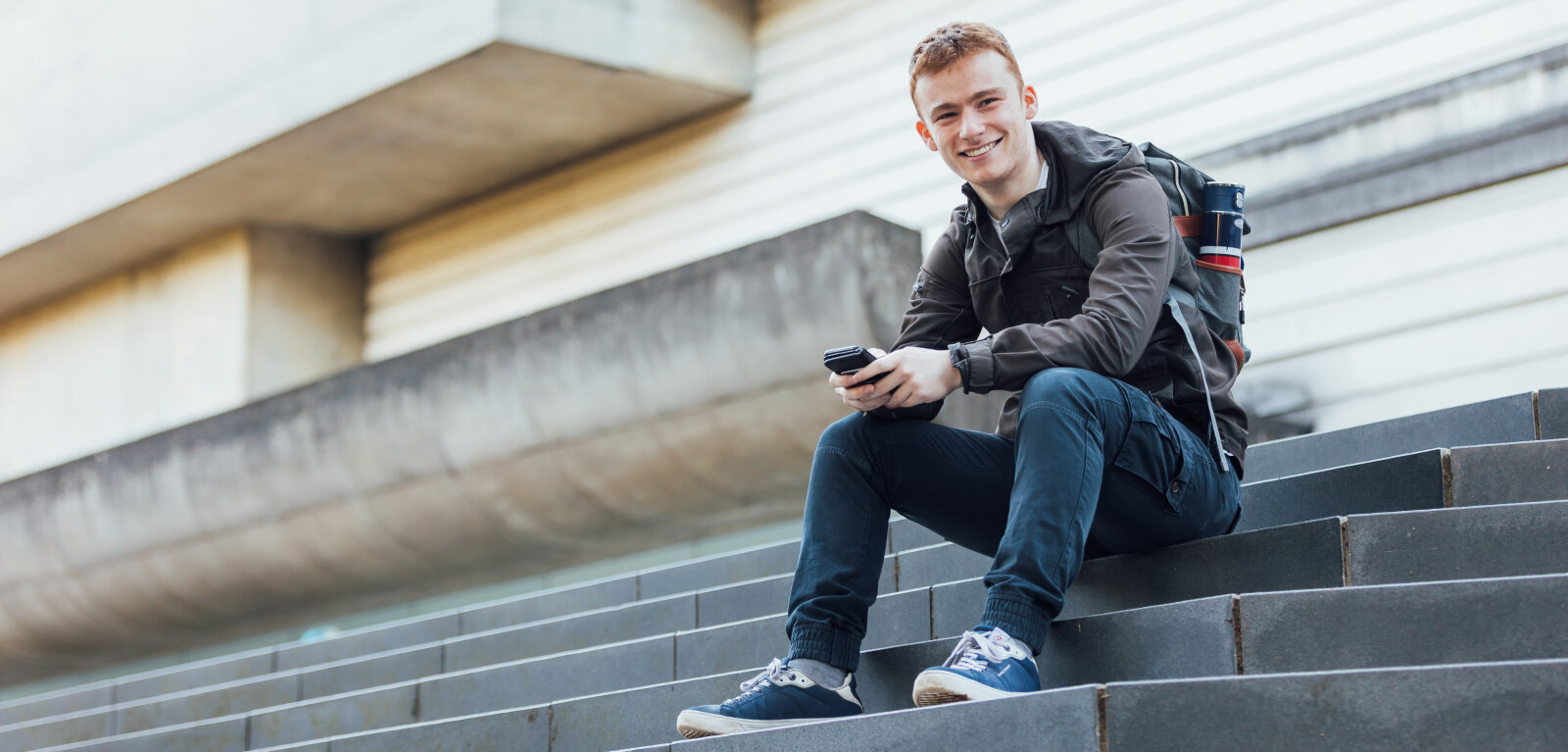 Student Conor sits on Ulster Museum steps