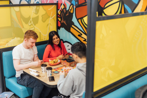 Students Sreyashi and Conor inside Reboot cafe