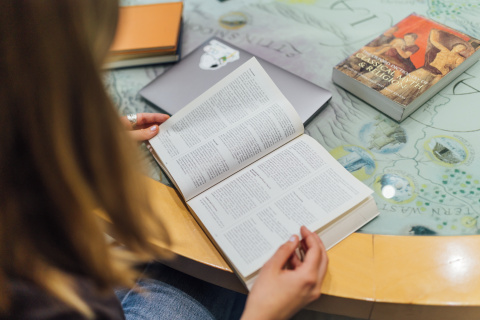 Student reading book in CS Lewis reading room