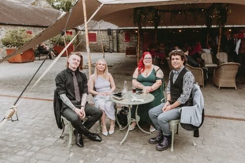 Four students at wedding