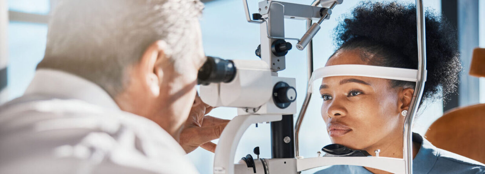 Ophthalmologist performing eye exam