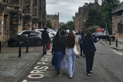 Students walking down a street in Glasgow