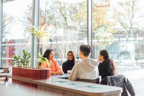 Four students sitting together in Social Cafe