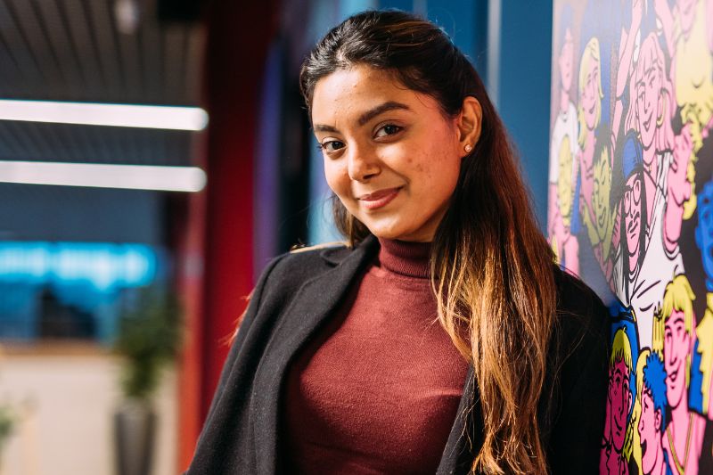 Student smiling and looking into the camera