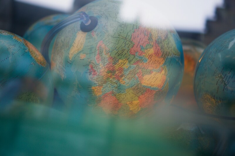 Model globe behind a window