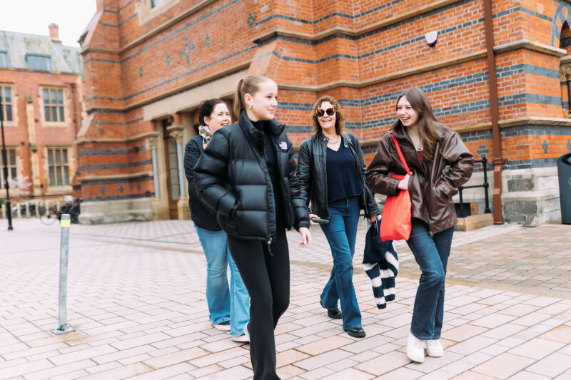 Group of applicants walk past the Graduate School on offer holder day
