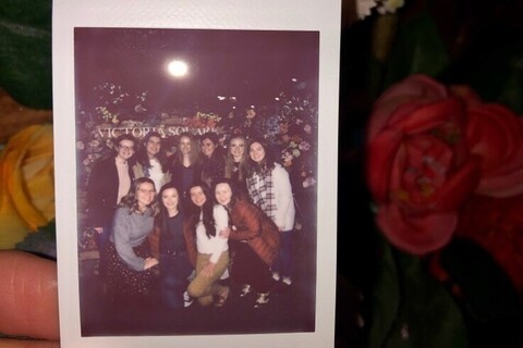 Group of students posing in a polaroid photo