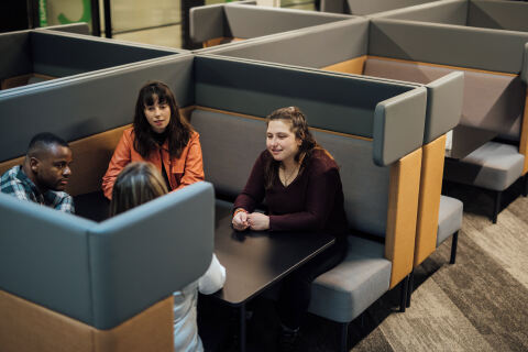 Group of students talking in One Elmwood student centre