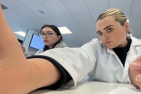 Two human biology students in a lab