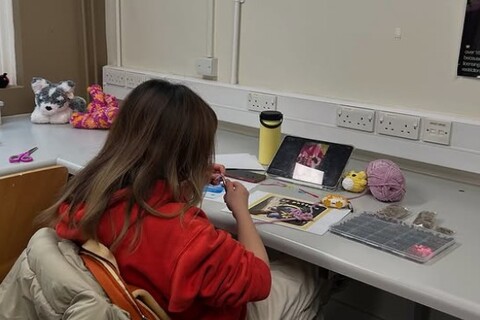 Student at Craft and Chill session hosted by the Inclusion Society at Queen's