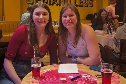 Two female students at the Inclusion Society's pub quiz