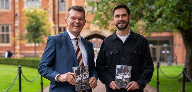 Professor Richard Miles and Dr Kieran Connell in the quadrangle holding Dr Connell's Wolfson Prize shortlisted book