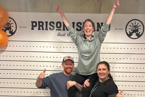 Student Lana on the shoulders of two friends at Prison Island