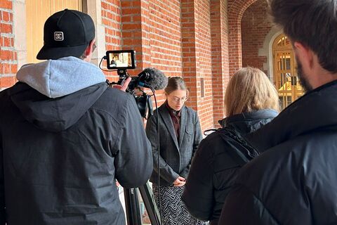 PhD student Lana shooting content with video team