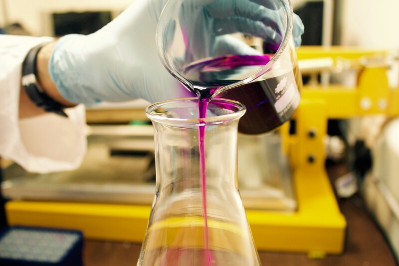 Liquid being poured into beaker