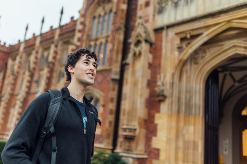 Student Lucas looking up at the front facade of the Lanyon