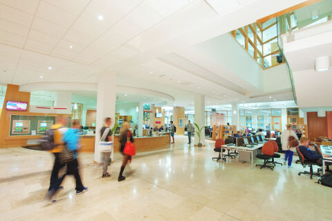 Students at workstations in The McClay Library, Queen's University Belfast