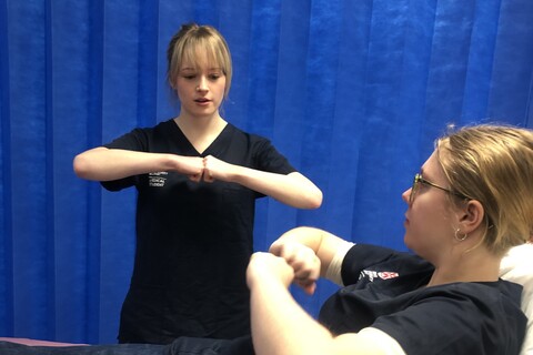 Two medicine students doing GP training