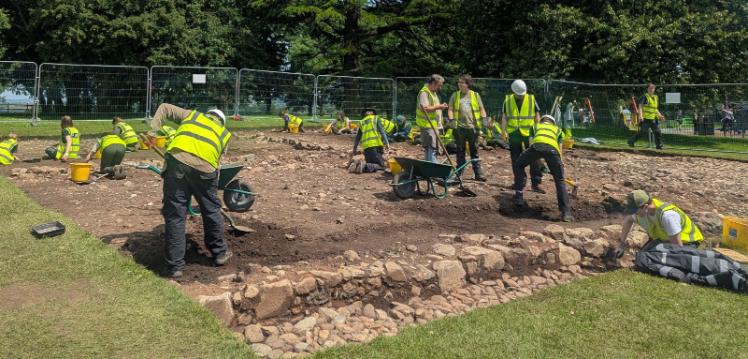 A group digging at an archaeology excavation in Moira