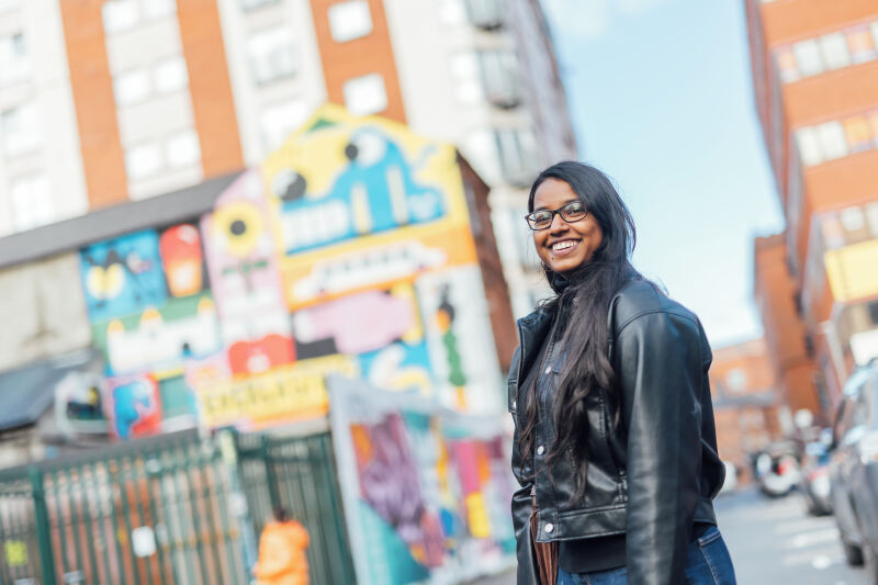Student Natasha smiling in Belfast street