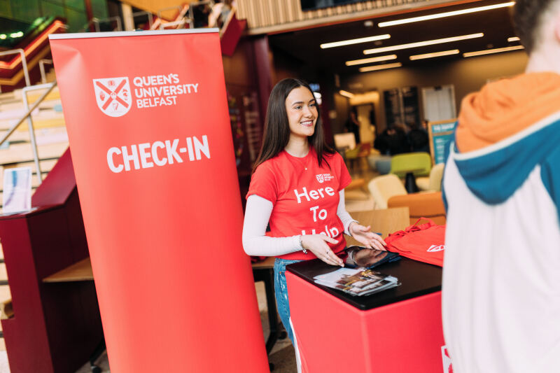 Student at check in desk at offer holder event