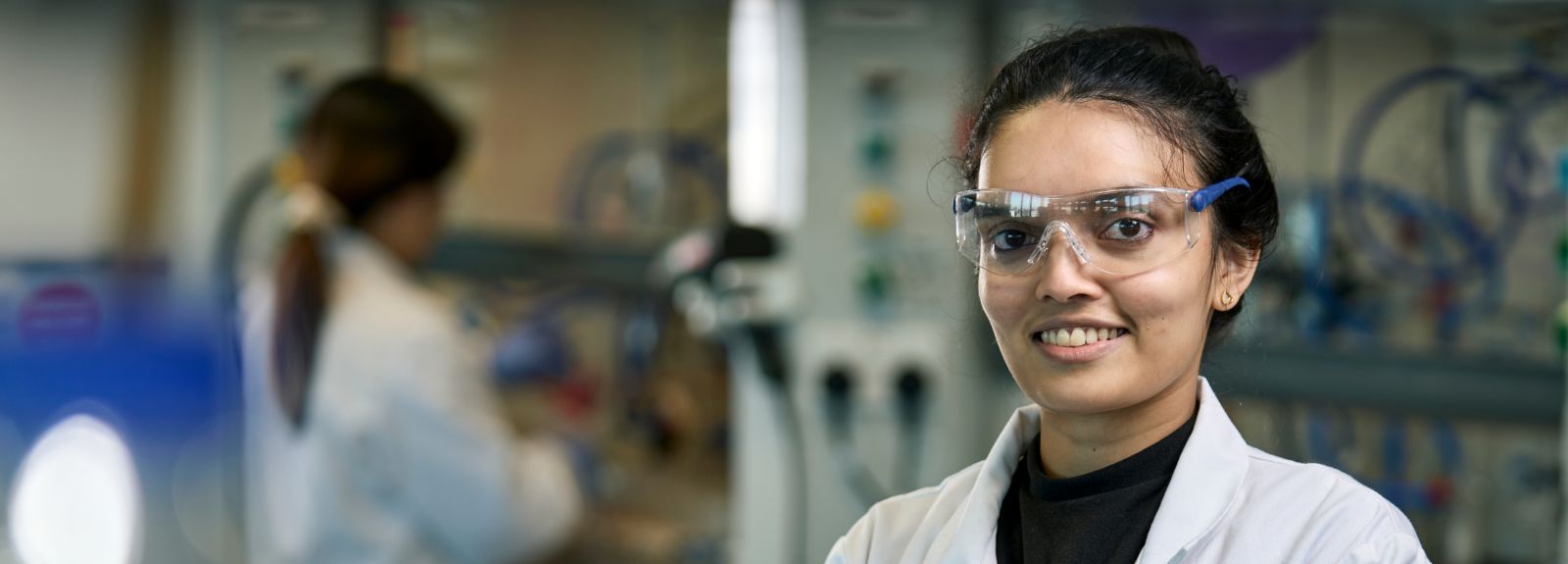 student in safety glasses