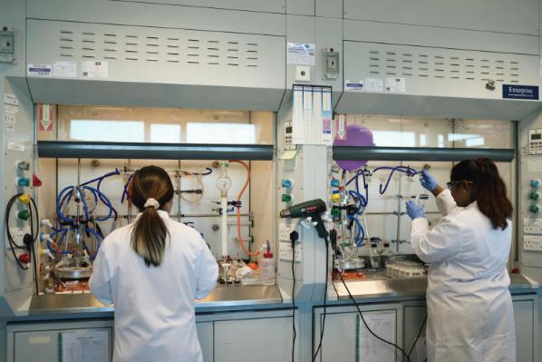 Researchers working in pharmacy lab