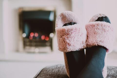Person wearing pink slippers
