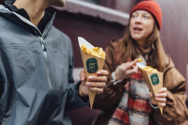 Students holding chip cones from the Poke Club