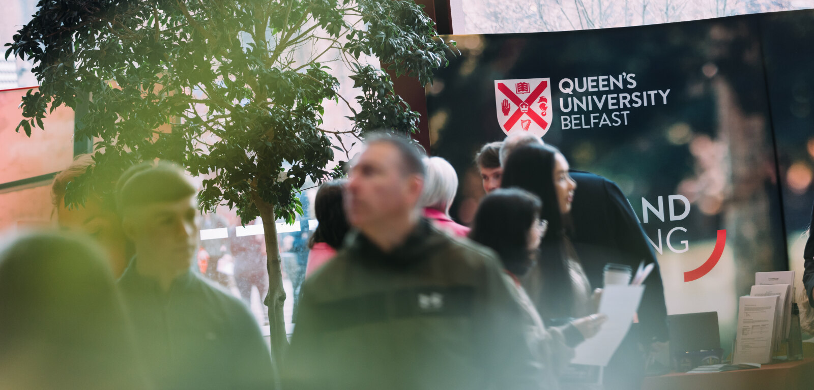 QUB logo on backdrop signage in the Students' Union