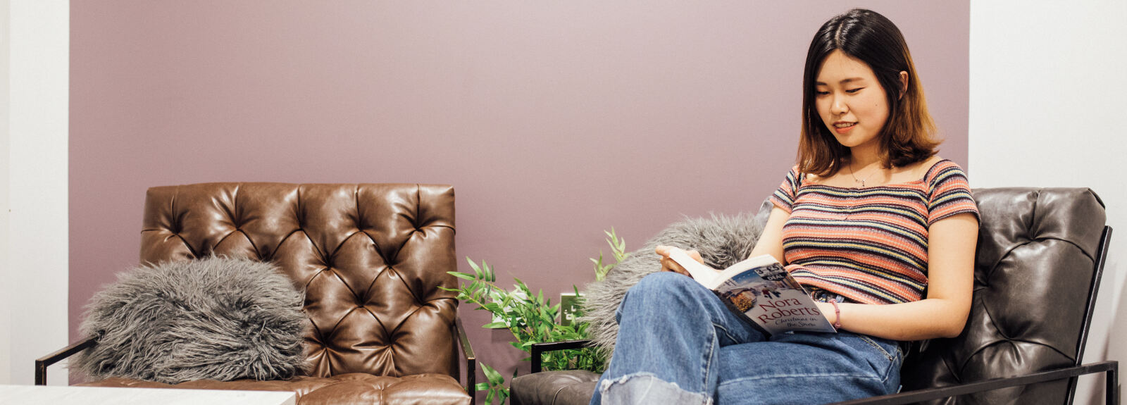 Queen's student reading book