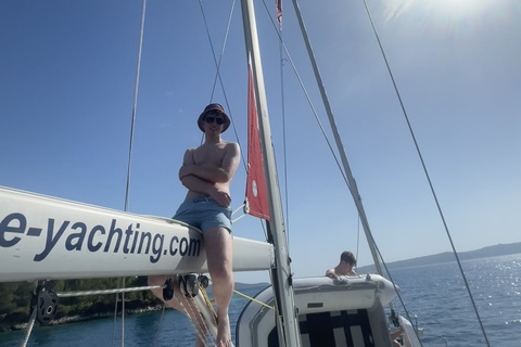 Student Eoghan sits on top of sail boat