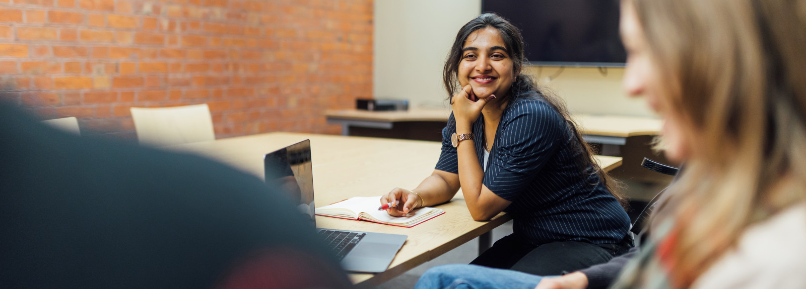 Student Sanjana in group study room in the Grad School