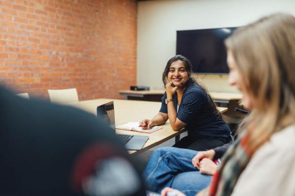 PGT student Sanjana sitting in group study room inside the Graduate School