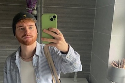 Student Scott takes mirror selfie