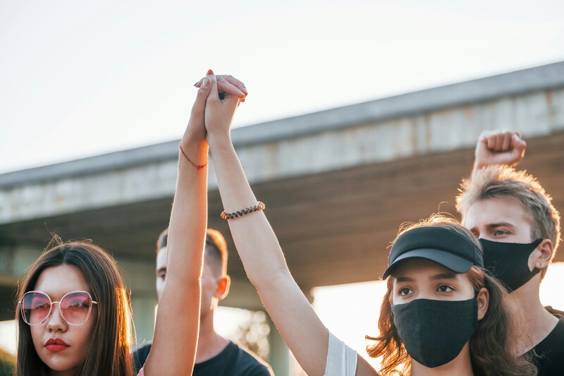 People holding hands in solidarity