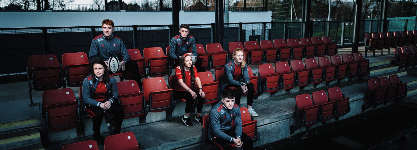 Queen's sports students sitting together