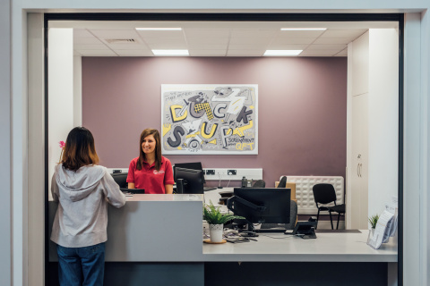Student talking to staff member at accommodation reception desk