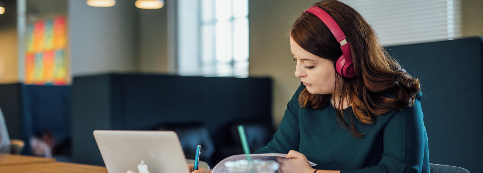 Student studying in front of Apple laptop