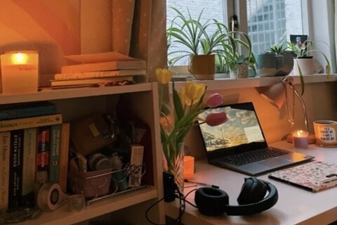 Student's bedroom with laptop on table