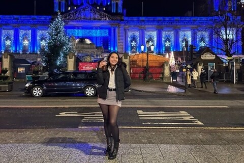 Female student standing outside City Hall