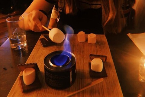 Student eating s'mores in Town Square