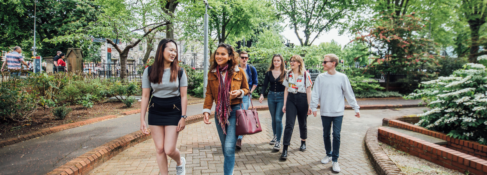 Group of students walking through campus