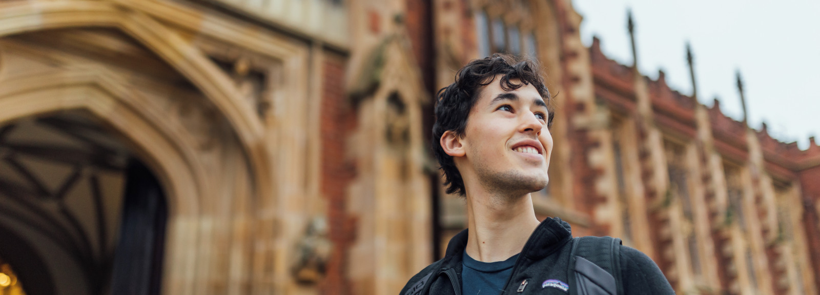 Student smiling outside the Lanyon