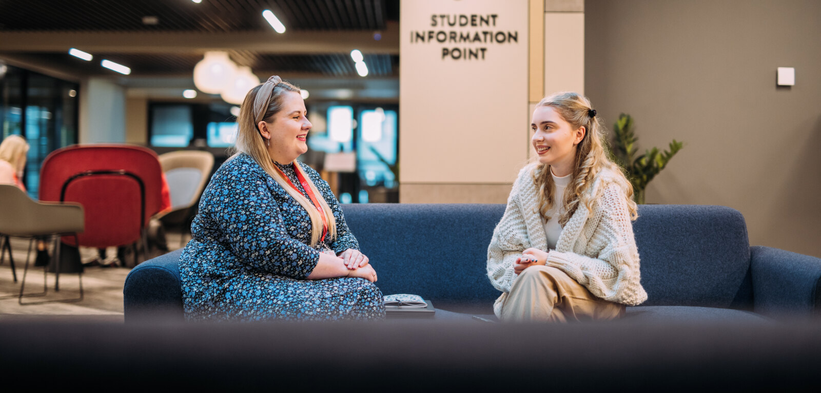 Student and staff having a discussion in One Elmwood
