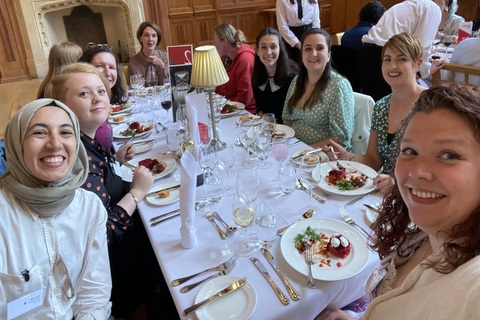 Students at a dinner table